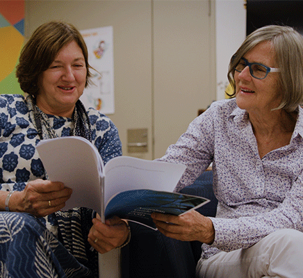 Professors Carol Bower and Elizabeth Elliott sit together while reviewing 'The Australian Guide to Diagnosis of FASD'