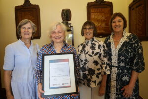 Dr Shaman Stone, AM (holding the award) was congratulated by the past recipients of the Sue Miers Lifetime Achievement Award, from left: Professor Carol Bower AC, Sue Miers, AM and Professor Ellizabeth Elliott AM.